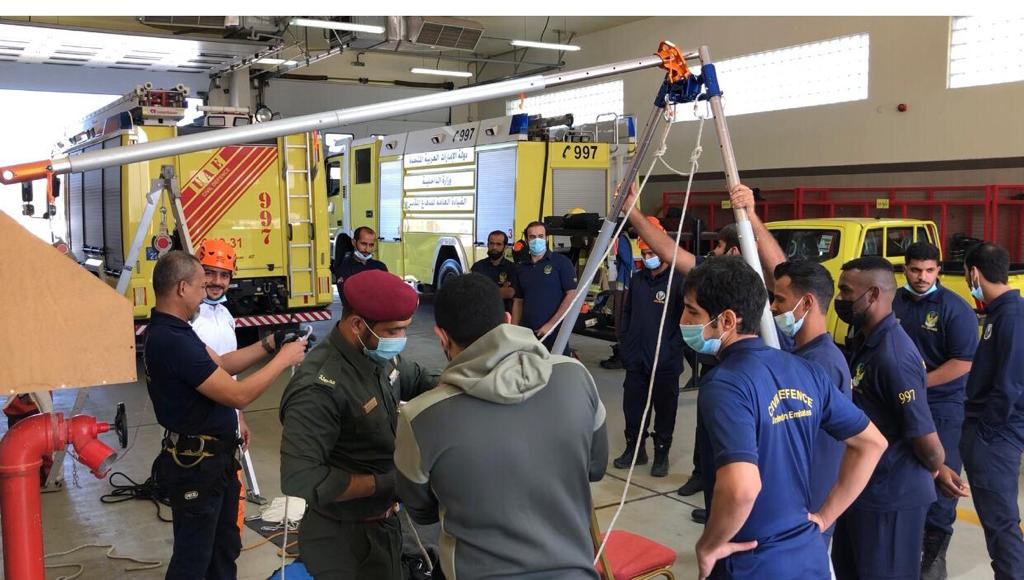 SWO (RET) Selamat (man on the far left) conducting Mountain Rescue training for the trainees at ADCDA