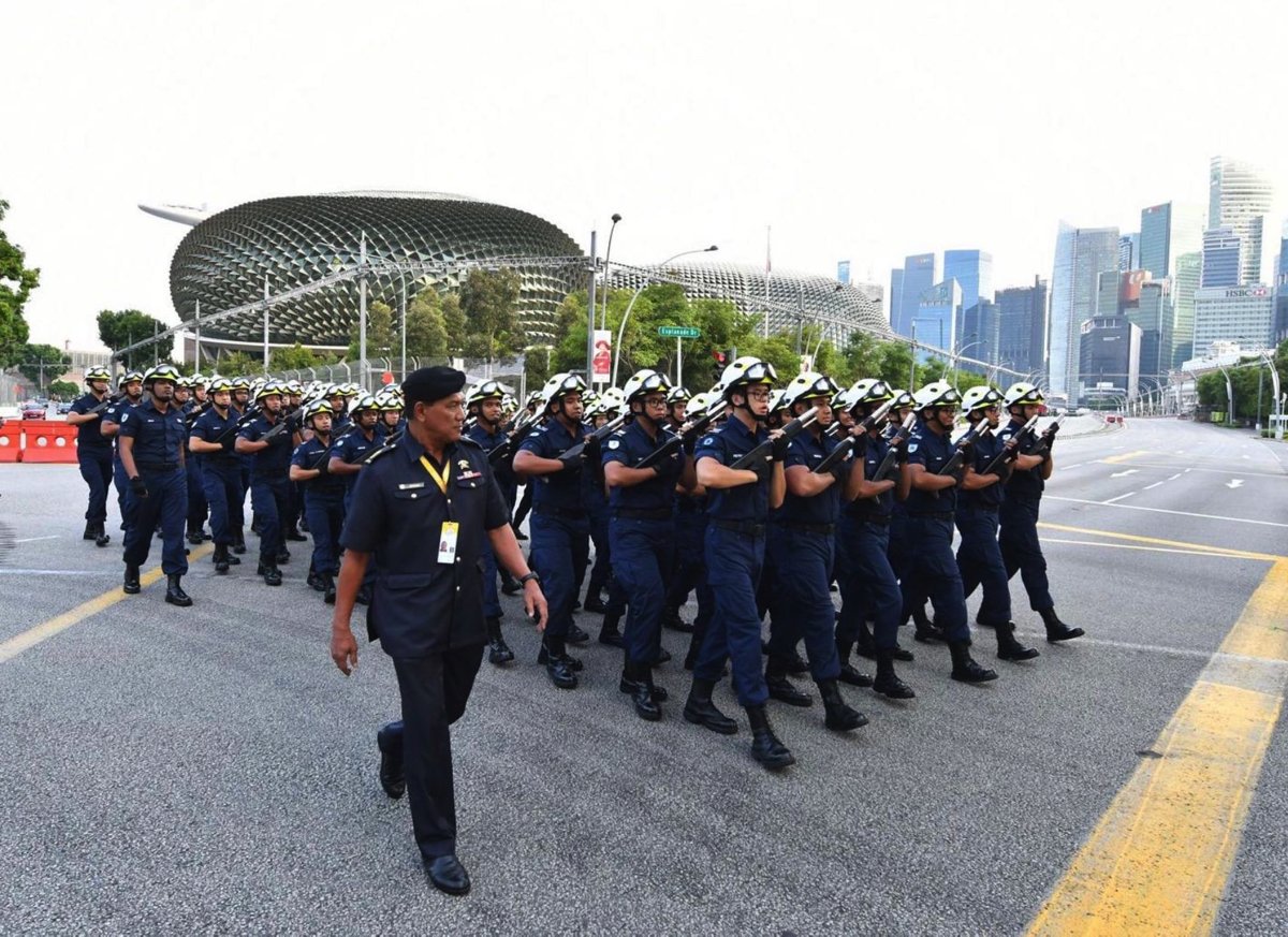 SWO1 Hayatu’llah leading the SCDF marching contingent to the parade square at the floating platform