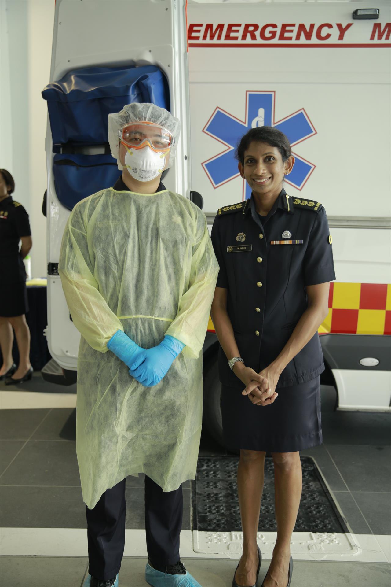 Minister Visit Heng Swee Keat @ Kallang Fire Station 00003 A frontline Emergency Medical Services (EMS) personnel (left) in full Personal Protective Equipment (PPE) with SCDF’s Chief Medical Officer, COL (Dr) Shalini Arulanandam (right).