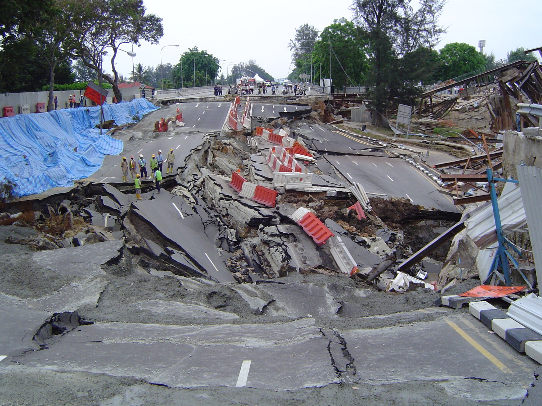 The massive devastation and the full view of the cave-in of the Nicoll Highway.