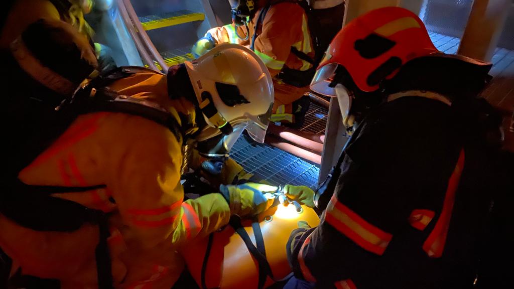 Trainees securing a “casualty” before hoisting operation