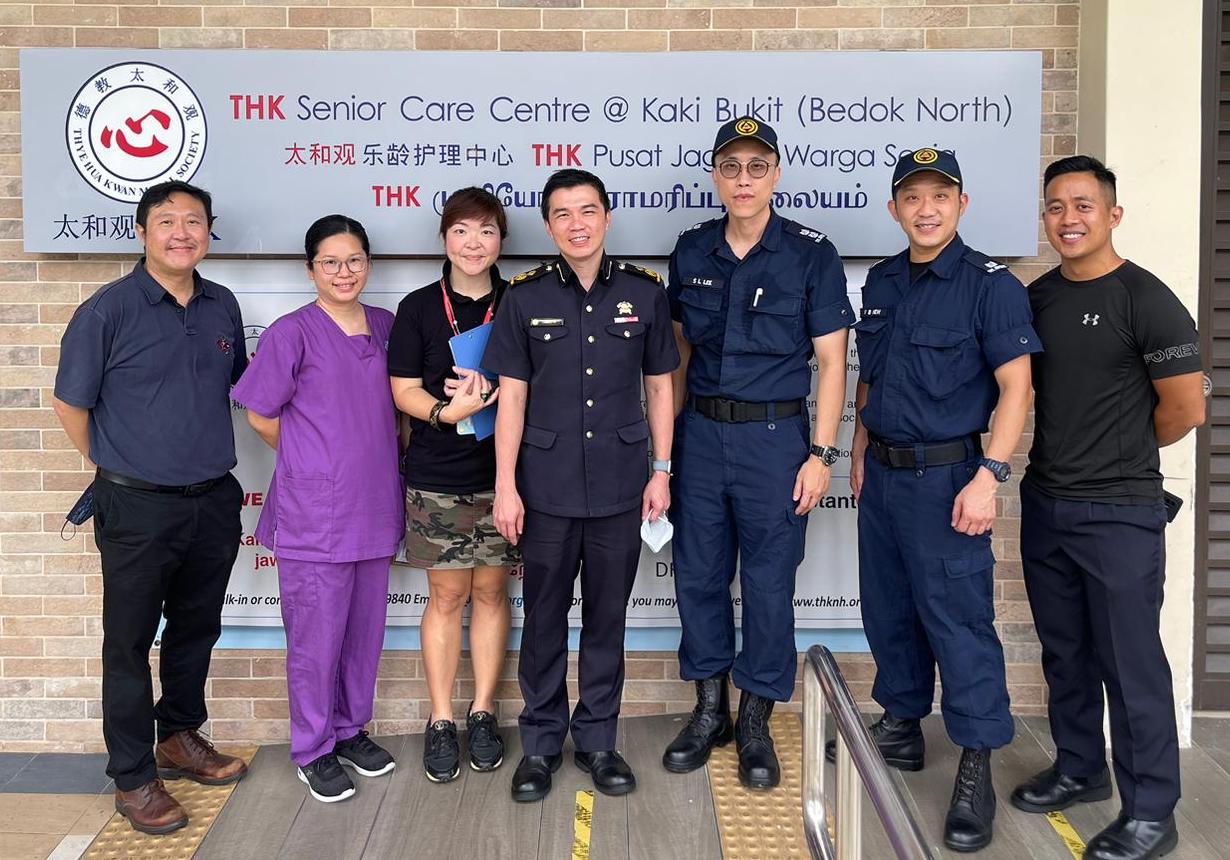 Group Photo In Front of THK SCC Signage